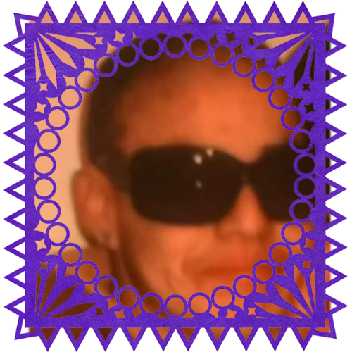 Photo of Joanna Monkey Maya in a frame with papel picado.