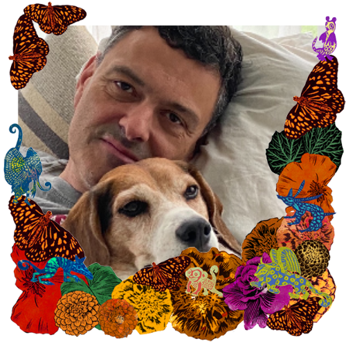 Photo of Joe Sharbel in a frame with marigolds, flowers, alebrijes and monarch butterflies.