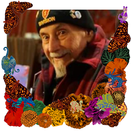 Photo of John M Garcia in a frame with marigolds, flowers, alebrijes and monarch butterflies.