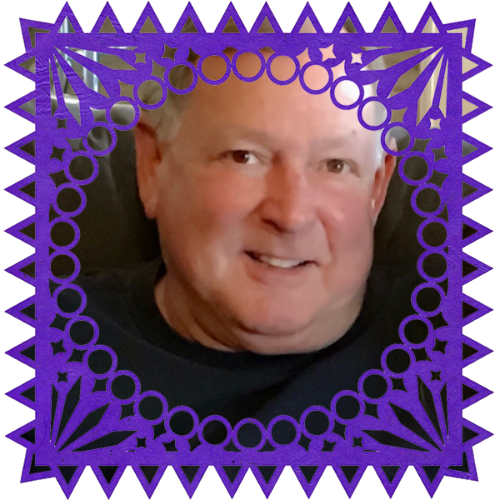 Photo of John Newton in a frame with papel picado.