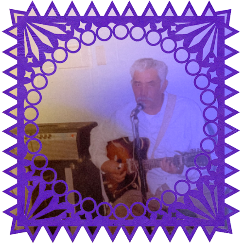 Photo of Jose Raul Barragan in a frame with papel picado.