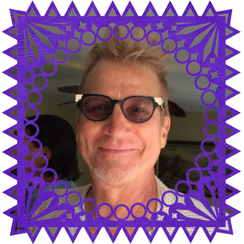 Photo of Joseph Skyward in a frame with papel picado.