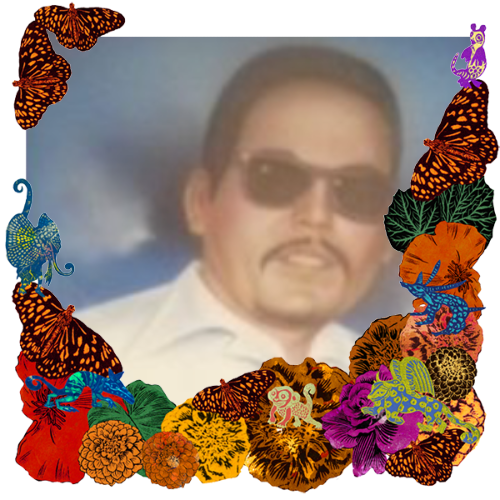 Photo of Juan Puentes in a frame with marigolds, flowers, alebrijes and monarch butterflies.