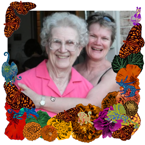 Photo of Judy in a frame with marigolds, flowers, alebrijes and monarch butterflies.