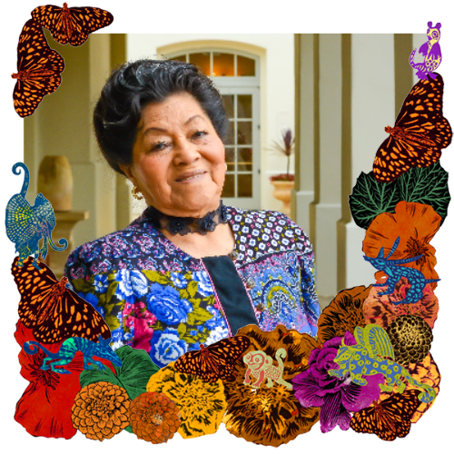 Photo of Julia Antonia Valladares Cabrera in a frame with marigolds, flowers, alebrijes and monarch butterflies.
