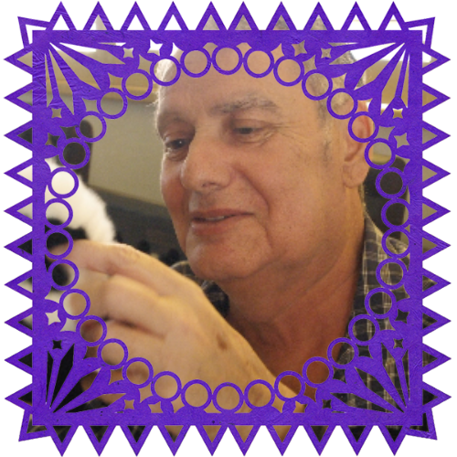 Photo of Lee Roy in a frame with papel picado.