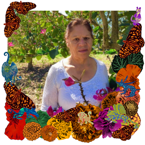 Photo of Lilia in a frame with marigolds, flowers, alebrijes and monarch butterflies.