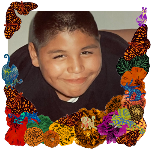 Photo of Luis in a frame with marigolds, flowers, alebrijes and monarch butterflies.