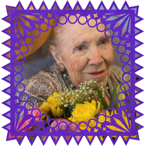 Photo of Lupe V. Mendoza in a frame with papel picado.