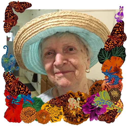 Photo of Madolin Martinec in a frame with marigolds, flowers, alebrijes and monarch butterflies.