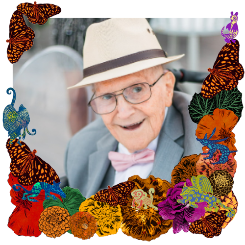 Photo of Marco A. Padilla in a frame with marigolds, flowers, alebrijes and monarch butterflies.