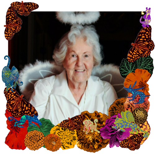 Photo of Margaret Kenney McSweeney in a frame with marigolds, flowers, alebrijes and monarch butterflies.