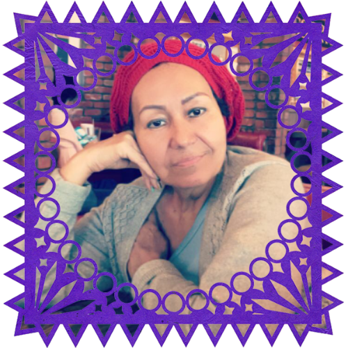 Photo of Margarita Luquin Franco in a frame with papel picado.