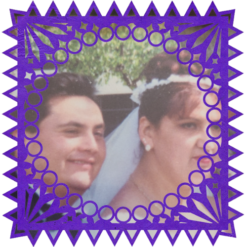 Photo of Mari and Alfonso Juarez in a frame with papel picado.