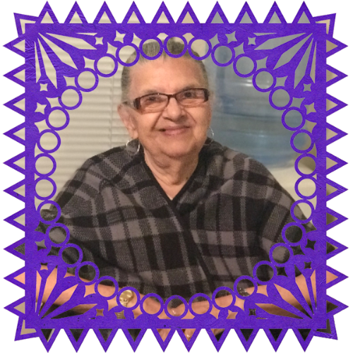 Photo of María Dolores Molina in a frame with papel picado.