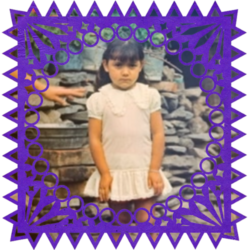 Photo of María de la Luz in a frame with