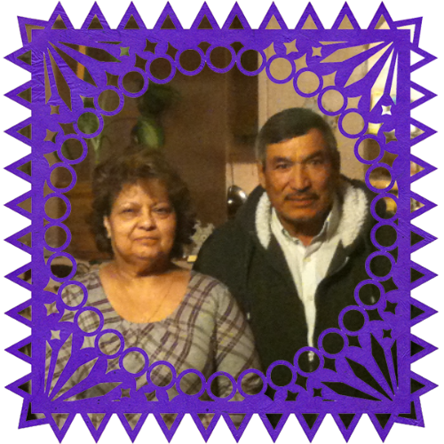 Photo of Martín Sr., & Guadalupe Díaz in a frame with papel picado.
