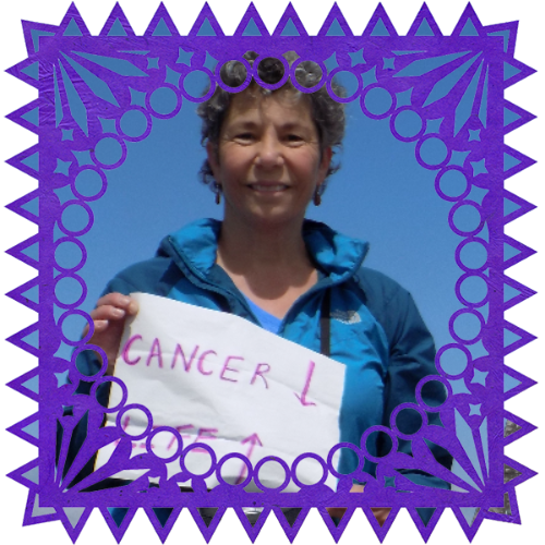 Photo of Mary Theresa Hench in a frame with papel picado.