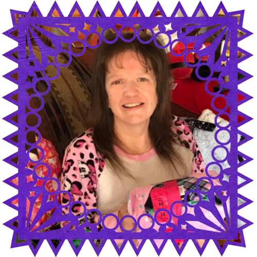 Photo of Melissa A Esquibel in a frame with papel picado.