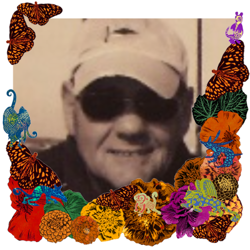 Photo of Michael in a frame with marigolds, flowers, alebrijes and monarch butterflies.