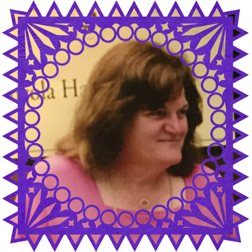 Photo of Michelle Smith in a frame with papel picado.