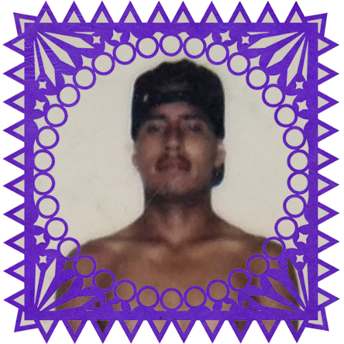 Photo of Miguel Vatana in a frame with papel picado.