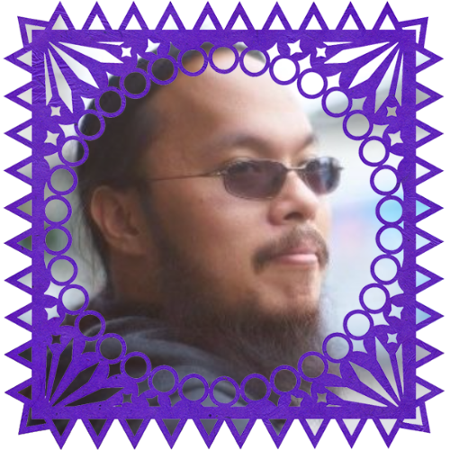 Photo of Mike Sanchez in a frame with papel picado.