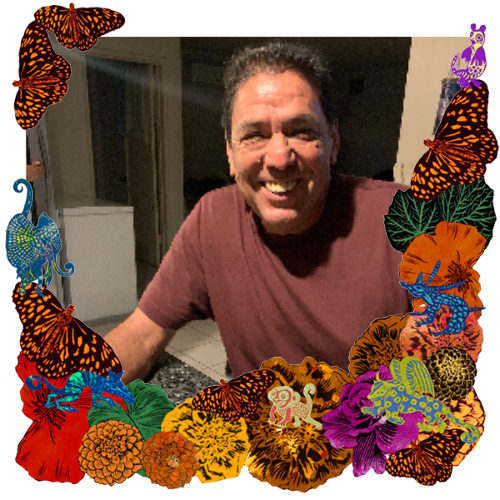 Photo of Remembering My Dad in a frame with marigolds, flowers, alebrijes and monarch butterflies.