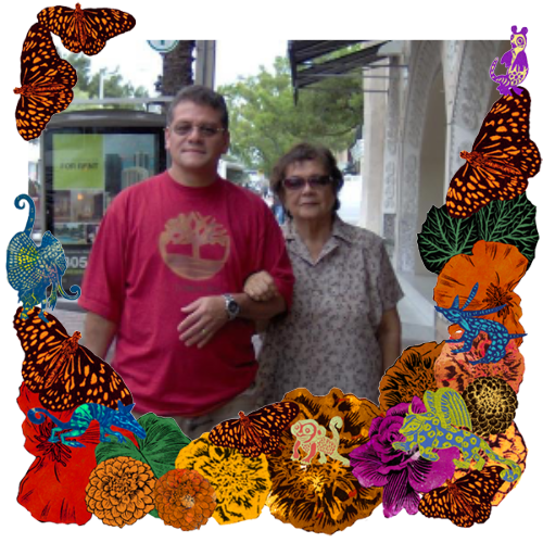 Photo of My father and my abuelita in a frame with marigolds, flowers, alebrijes and monarch butterflies.