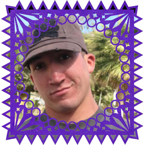 Photo of JC in a frame with papel picado.