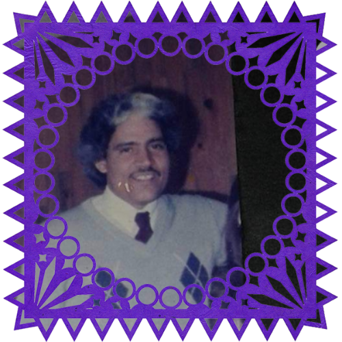 Photo of My brother in a frame with papel picado.