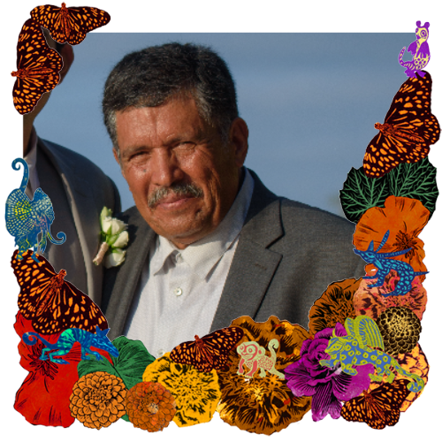 Photo of My father in a frame with marigolds, flowers, alebrijes and monarch butterflies.