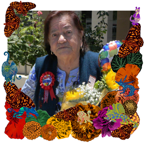 Photo of My grandma Paula in a frame with marigolds, flowers, alebrijes and monarch butterflies.
