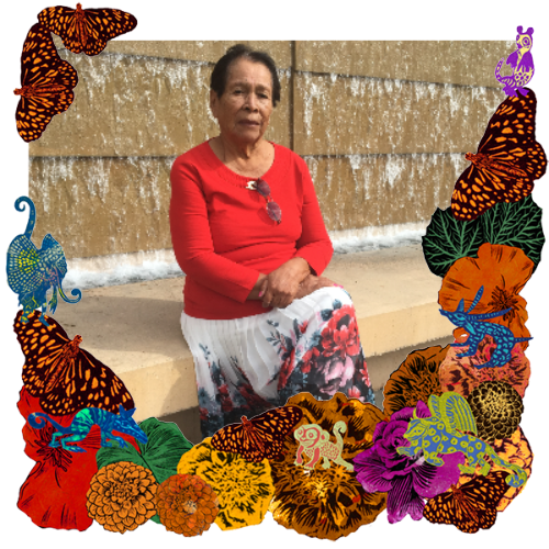 Photo of My great-great-grandma in a frame with marigolds, flowers, alebrijes and monarch butterflies.