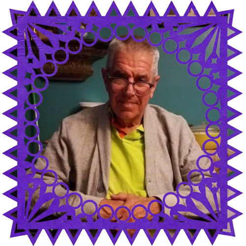 Photo of My uncle in a frame with papel picado.