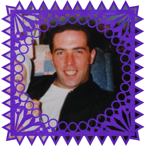 Photo of Neal W. McKeon in a frame with papel picado.