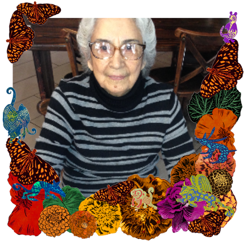 Photo of Nellie Chavez in a frame with marigolds, flowers, alebrijes and monarch butterflies.