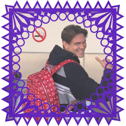 Photo of Nicholas Joseph Bell in a frame with papel picado.