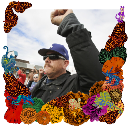 Photo of Pablo Aceves Presente! in a frame with marigolds, flowers, alebrijes and monarch butterflies.