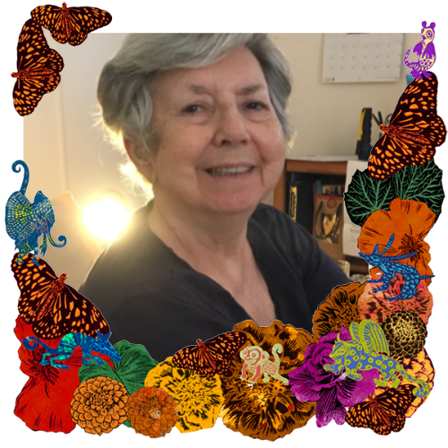 Photo of Paula Scott in a frame with marigolds, flowers, alebrijes and monarch butterflies.
