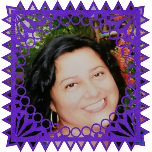 Photo of Pearl Mercado in a frame with papel picado.