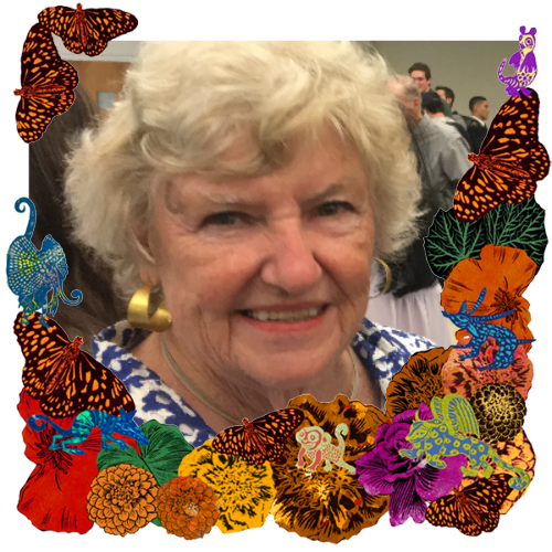 Photo of Peggy in a frame with marigolds, flowers, alebrijes and monarch butterflies.