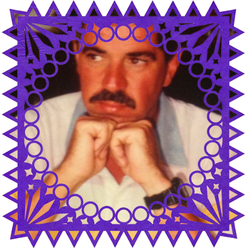 Photo of Peter Gerritson in a frame with papel picado.
