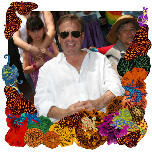 Photo of Ralph Hyatt in a frame with marigolds, flowers, alebrijes and monarch butterflies.