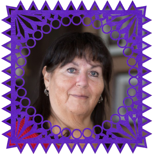 Photo of Rita Martinez in a frame with papel picado.
