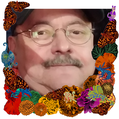 Photo of Robert Leon in a frame with marigolds, flowers, alebrijes and monarch butterflies.