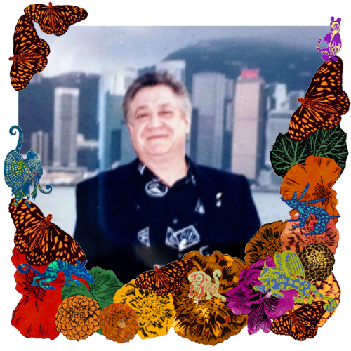 Photo of Roberto Ruiz in a frame with marigolds, flowers, alebrijes and monarch butterflies.