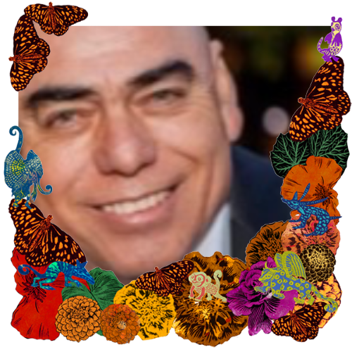 Photo of Rodolfo Valenzuela in a frame with marigolds, flowers, alebrijes and monarch butterflies.