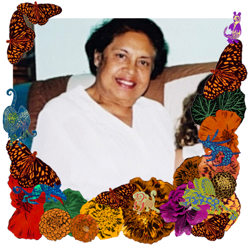 Photo of Rosalie in a frame with marigolds, flowers, alebrijes and monarch butterflies.