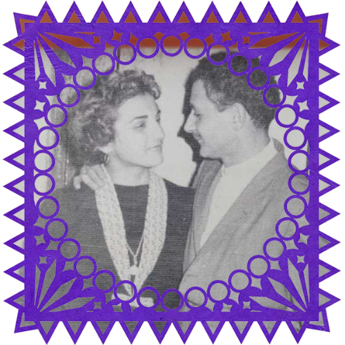 Photo of Rosita y Mingo in a frame with papel picado.